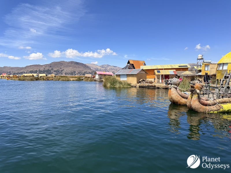 Nestled high in the Andes, Lake Titicaca is a marvel of nature. It is the highest navigable lake in the world. This majestic body of water straddles the border between Peru and Bolivia. Amidst its vast expanse lie the Uros Floating Islands. These islands are a testament to human ingenuity and resilience. Crafted entirely from totora reeds, they float gracefully on the lake's surface. The Uros people have called these islands home for centuries. They originally sought refuge here from hostile neighbors. Today, their unique way of life continues to captivate visitors. Each island is a living, breathing community. The Uros maintain their islands by adding fresh reeds as the old ones decay. This constant renewal is a symbol of their enduring spirit. Visitors to the Uros Floating Island Peru are welcomed with warmth and hospitality. The Uros share their traditions, crafts, and stories with pride. It's an opportunity to experience a culture deeply connected to its environment. A visit to these islands offers more than just stunning views. It provides a glimpse into a lifestyle that harmonizes tradition and modernity. The Uros Floating Islands are a cultural treasure waiting to be explored. The Enchanting Setting: Lake Titicaca and Its Significance Lake Titicaca is more than a geographical wonder. It holds great significance in Andean mythology. Many consider it the birthplace of the Inca civilization. The lake stretches across 3,232 square miles between Peru and Bolivia. Its sparkling waters reflect the sky and surrounding mountains. This creates a magical and serene environment that enchants travelers. Beyond its beauty, the lake serves as a vital resource. Local communities depend on its waters for fishing and transportation. It also supports a unique ecosystem, rich with diverse flora and fauna. Culturally, Lake Titicaca plays a crucial role in the lives of its people. It influences their traditions, beliefs, and folklore. The lake's mystical allure is woven into numerous legends and tales. Key aspects of Lake Titicaca include: It is the highest navigable body of water on Earth, at 3,812 meters above sea level. The lake is shared by two nations, Peru and Bolivia, reflecting its shared cultural heritage. Lake Titicaca nurtures over 500 aquatic species, including endemic fish. Surrounding areas host ancient archaeological sites tied to pre-Columbian civilizations. This extraordinary setting provides a backdrop for exploring the Uros Islands. It invites travelers to immerse themselves in the region's rich cultural and natural tapestry. Origins of the Uros Floating Islands: History and Ingenuity The Uros Floating Islands represent an incredible human innovation. They are a unique response to the challenges posed by the region's history and geography. This ingenuity has enabled the Uros people to thrive on the lake for centuries. Originally, the Uros settled on the islands as a defense mechanism. They sought refuge from aggressive neighboring tribes. By constructing movable islands, they could evade threats and ensure their communities' safety. Creating these islands required significant creativity. The Uros used totora reeds, which grow abundantly in Lake Titicaca. These reeds form the island's base, offering both buoyancy and structure. Maintaining the islands is a continuous process. The reeds decay at the bottom, so new layers are added regularly. This sustains the islands and protects the community. Key historical and innovative practices of the Uros reed island Peru: Using totora reeds for construction and sustenance, including housing and traditional reed boats. Developing movable islands, offering safety and adaptability. Navigating Lake Titicaca's vast waters, cultivating unique fishing techniques. Preserving traditional lifestyles while adapting to modern influences and tourism. This cultural adaptability speaks volumes about the Uros' resilience. Despite environmental and social challenges, they have maintained their way of life. Their history underscores a story of survival and creativity. Through these floating islands, the Uros continue to inspire. They showcase how tradition can blend with practicality to create a sustainable existence. Today, the islands stand as a testament to human ingenuity and cultural persistence. Life on the Reed Islands: Daily Routines and Community Life on the Uros Floating Islands is a delicate balance of tradition and modernity. The residents maintain a lifestyle that has remained relatively unchanged for generations, yet they've adeptly integrated aspects of contemporary life. A typical day begins with the sunrise over Lake Titicaca. The Uros rise early to greet the new day and attend to daily chores. The beauty of their surroundings provides a peaceful start to their busy routines. Fishing is a central part of daily life, vital for both sustenance and economic trade. Men often set out in their reed boats to catch a variety of fish, essential to the Uros diet. Meanwhile, women engage in crafting and weaving. Reed weaving is more than just a necessity; it's an art form. The women create stunning handicrafts and textiles, which are sold to tourists. These crafts reflect the vibrant colors and patterns distinctive to Uros culture. Community life thrives with a strong sense of kinship and cooperation. Shared responsibilities keep the islands running smoothly. Elders play a vital role in passing down knowledge and cultural traditions to younger generations. Celebrations and festivals mark the calendar year with vibrancy. Traditional music, dance, and food are central to these gatherings, strengthening community bonds. Spiritual practices and storytelling also weave through daily life. Key aspects of daily life on the islands include: Fishing as a livelihood and cultural practice. Reed weaving for artistic and economic purposes. Community events that reinforce social connections. Transmission of traditional practices through storytelling and guidance from elders. In this enchanting setting, the Uros balance simplicity with rich cultural traditions. Their way of life offers a profound glimpse into a community that lives harmoniously with its environment. The Art of Reed Construction: Building and Maintaining the Islands The Uros Floating Islands are an extraordinary example of human ingenuity. Crafted from the totora reed, these islands illustrate a unique interaction between nature and human innovation. Creating the islands begins with gathering the essential totora reeds. These plants grow abundantly in Lake Titicaca's shallow waters. The reeds are cut, dried, and layered intricately to form the islands' foundation. The construction technique is both practical and adaptive. The dense layers ensure buoyancy while providing a firm surface. Continuous maintenance is crucial since the lower layers of reeds gradually decay. Every island is a collaborative effort. Families and communities work together to ensure structural integrity. Adding new layers of reeds is a regular task, requiring diligence and unity. Building and maintaining the islands involve: Harvesting totora reeds from the lake. Layering reeds to create a stable, floating platform. Regularly replenishing decayed layers with fresh reeds. Community collaboration for maintaining and repairing the structures. This craftsmanship is not only a necessity but also a cultural expression. The Uros people's expertise in reed construction is passed down through generations. This knowledge stands as a testament to their resilience and enduring way of life. In the interplay of labor and artistry, the islands emerge as both functional habitats and cultural landmarks. They represent a harmonious blend of tradition and skill. Uros Culture: Language, Traditions, and Spirituality The cultural tapestry of the Uros is richly woven with language, rituals, and beliefs. The Uros people primarily speak Aymara, with some fluent in Quechua and Spanish. These languages reflect a deep connection to their heritage and enhance their interactions with visitors. Traditions on the islands are vibrant and full of life. Music and dance play an integral role in Uros culture, serving as vessels for storytelling and celebration. Traditional crafts, such as weaving intricate textiles and crafting reed boats, are taught from generation to generation. The spiritual life of the Uros is deeply tied to Lake Titicaca. The lake is considered sacred, representing a source of life and spiritual sustenance. The Uros people maintain a close connection to nature, evident in their daily practices and rituals. Key aspects of Uros culture include: Preserving Aymara language and engaging in traditional crafts. Celebrating life through music, dance, and oral traditions. Honoring the sacred lake and practicing spiritual rituals. Cultural preservation remains vital for the Uros community. They actively engage in sharing their stories and customs with visitors, ensuring their legacy endures. The islands provide an extraordinary glimpse into a way of life that harmonizes tradition with the natural world. This cultural richness stands as a testament to the resilience and depth of the Uros heritage. The Largest Floating Island: Community Hubs and Social Life The largest of the Uros floating islands acts as the heart of social and cultural life on the lake. Here, several families coexist, fostering a tight-knit community environment. This island serves as a hub for communal activities and shared resources, like schools and meeting areas. Community life revolves around cooperation and mutual support. Families engage in collective tasks such as maintaining the reed structures and organizing local events. Social gatherings often center around communal spaces, where stories, music, and laughter fill the air. Key features of the largest floating island include: Multi-family living with collaborative daily routines. Shared educational facilities and communal meeting spaces. Hosting social events that strengthen community bonds. The island is more than just a living area; it's a place of learning and interaction. Children play and learn together, while adults plan and execute shared projects. This unique social structure reflects the importance of community and togetherness, making life on the floating island both vibrant and harmonious. These social interactions are essential for preserving the rich cultural heritage of the Uros people, ensuring traditions are passed on through generations. Uros Floating Islands Tour: What to Expect and How to Visit Embarking on a Uros Islands tour offers a journey into the captivating world of the Uros people. Visitors can expect a warm welcome as they step onto the soft, springy reed surfaces. Guided tours provide deep insights into the daily life and heritage of these resilient islanders. The tour typically starts with an introduction to the islands' construction. Guides explain the intricate process of weaving totora reeds to form the islands' sturdy base. Visitors often witness a demonstration of how these buoyant islands are maintained and preserved. During your visit, you'll have the opportunity to interact with the island's inhabitants. The Uros people gladly share their traditions, languages, and crafts. Handmade souvenirs, like vibrant textiles and intricate reed boats, are available for purchase, offering a piece of Uros culture to take home. Key experiences to anticipate on an Uros islands tour include: Educational talks on reed island construction and maintenance. Interactive sessions with the Uros people, including craft demonstrations. Stunning views of Lake Titicaca's expansive, serene waters. Travelers interested in an immersive experience might consider staying overnight. Some islands offer homestays, providing a firsthand glimpse into daily life. These stays support the community while offering a truly unique perspective on life in this tranquil setting. Access to the Uros Islands typically begins in Puno, the region's gateway city. From there, numerous tour operators offer packages to suit various interests and budgets. Whether opting for a brief visit or a longer stay, the Uros Floating Islands promise an unforgettable cultural encounter on the shimmering waters of Lake Titicaca. Responsible Tourism: Supporting the Uros and Sustainable Travel Visiting the Uros Floating Islands offers a chance to embrace responsible tourism. By supporting the Uros community, travelers contribute to preserving their unique way of life. A mindful approach to visiting helps protect the delicate environment of Lake Titicaca. Sustainable travel emphasizes respect for both cultural heritage and natural resources. Visitors are encouraged to engage thoughtfully with the community, gaining genuine insights into their traditions. Purchasing locally made crafts directly supports the artisans, providing them with a vital source of income. To ensure a positive impact, consider these tips for responsible tourism: Choose tour operators committed to sustainability and local partnerships. Follow the community's guidelines for behavior and interactions. Avoid using single-use plastics, minimizing waste on the islands. While exploring the floating islands, travelers can foster cultural exchange through respectful dialogue. This engagement enriches the visitor experience while honoring the profound spiritual connection the Uros people have with their land. Together, visitors and locals can create a travel experience that benefits all, safeguarding the islands for future generations. As a result, the enduring spirit and resilience of the Uros community continue to thrive in harmony with their environment. Practical Tips for Content Creators and Travel Agents Content creators seeking to capture the essence of the Uros Floating Islands should prioritize authenticity. Immersing themselves in local experiences will enrich their narratives. Engage deeply with the residents, learning about their daily lives and traditions. For travel agents, crafting an itinerary that highlights both cultural and natural elements is key. Ensure that tours include interactive experiences, such as observing reed boat building or participating in local dance performances. Highlighting the ingenuity and adaptability of the Uros people can make itineraries stand out. To maximize the impact of your content or travel packages, consider the following: Engage with local guides for insider perspectives. Feature compelling visuals like sunrise over Lake Titicaca. Emphasize sustainable practices in your narratives or tours. Incorporating these elements not only elevates the quality of your content but also strengthens the cultural understanding of your audience or clients. By showcasing the vibrant culture of the Uros Islands, you can inspire others to explore these remarkable floating communities responsibly. This approach benefits both the community and the broader travel landscape by fostering appreciation and respect for indigenous cultures. Conclusion: Preserving Heritage and Inspiring Exploration The Uros Floating Islands stand as a powerful testament to human resilience and creativity. They remind us of the importance of sustaining cultural traditions amidst modern challenges. By visiting these unique islands, travelers are invited to witness an ancient lifestyle preserved through generations. The experience of exploring the Uros Islands offers more than just a picturesque setting. It provides a deep cultural insight and an appreciation of sustainable living practices. Whether you're a content creator or a travel agent, sharing the story of the Uros Floating Islands can inspire others to seek out and respect indigenous cultures around the globe. By promoting responsible tourism, we contribute to preserving this heritage for future adventurers.