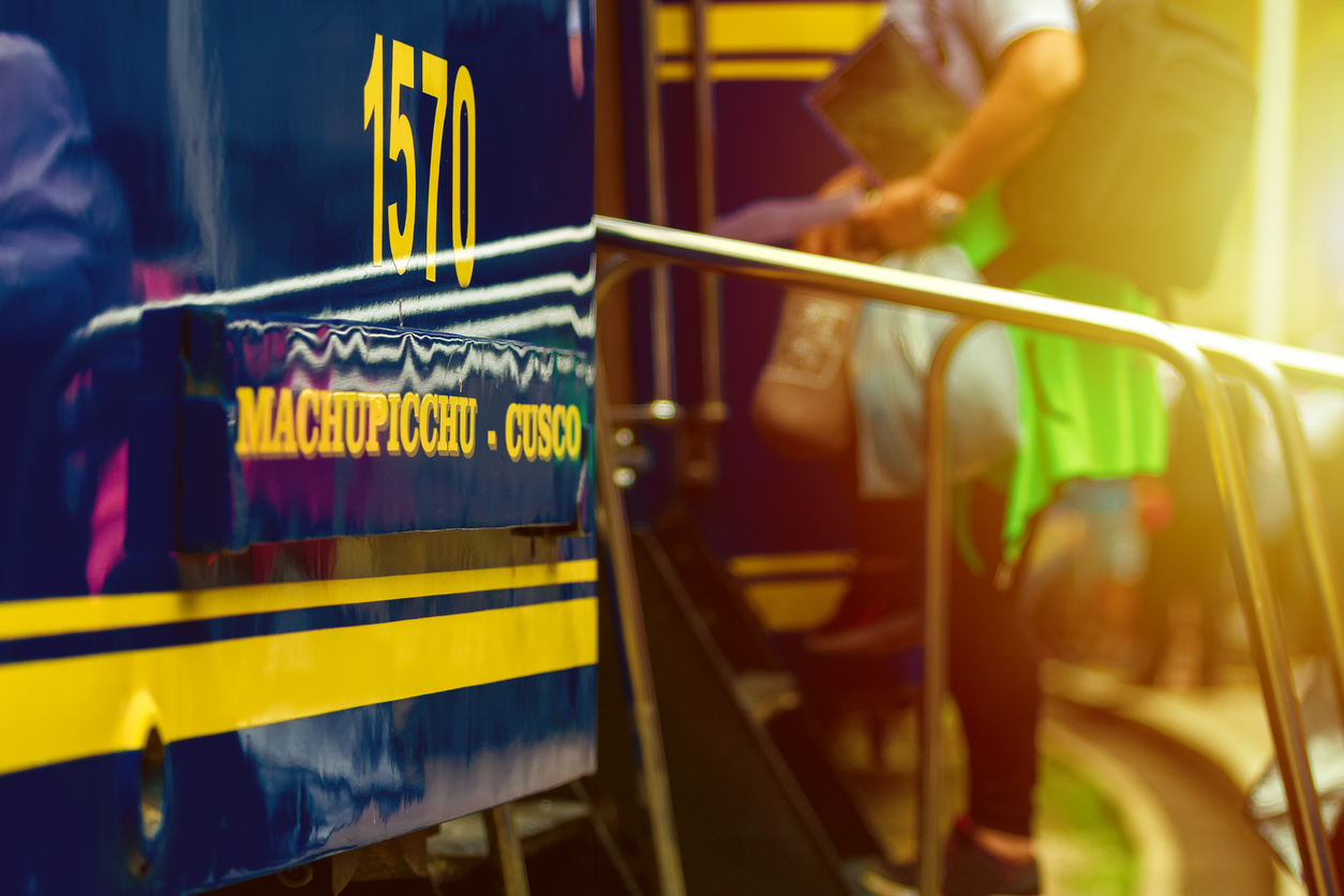 Wagon number of a train Machu Picchu-Cusco with man boarding in the background