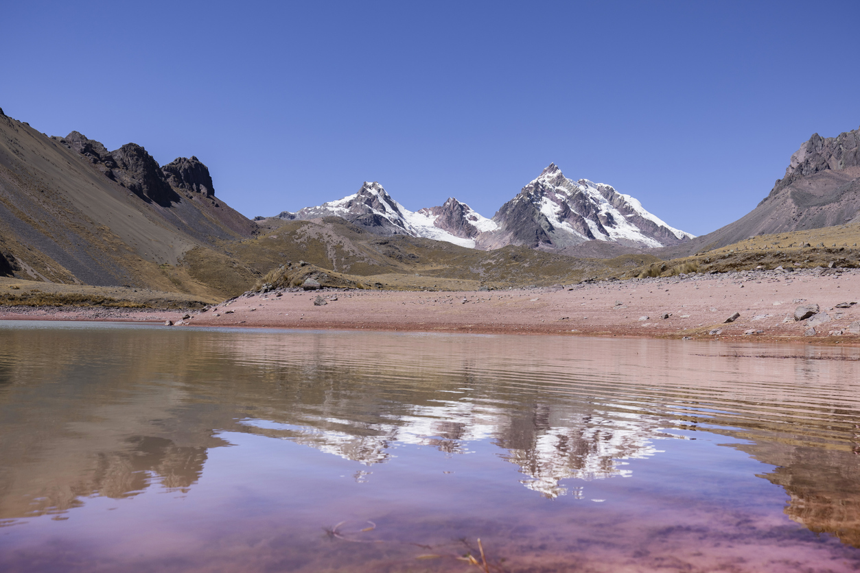 Red lagoon at Seven Ausangate lagoons in Cusco Region Peru